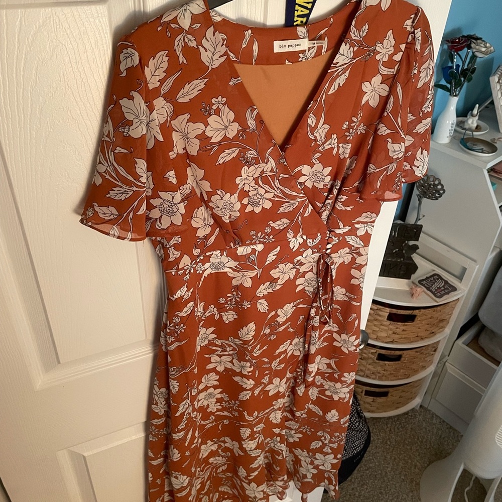 Floral rust midi dress with an overlapping leg slit